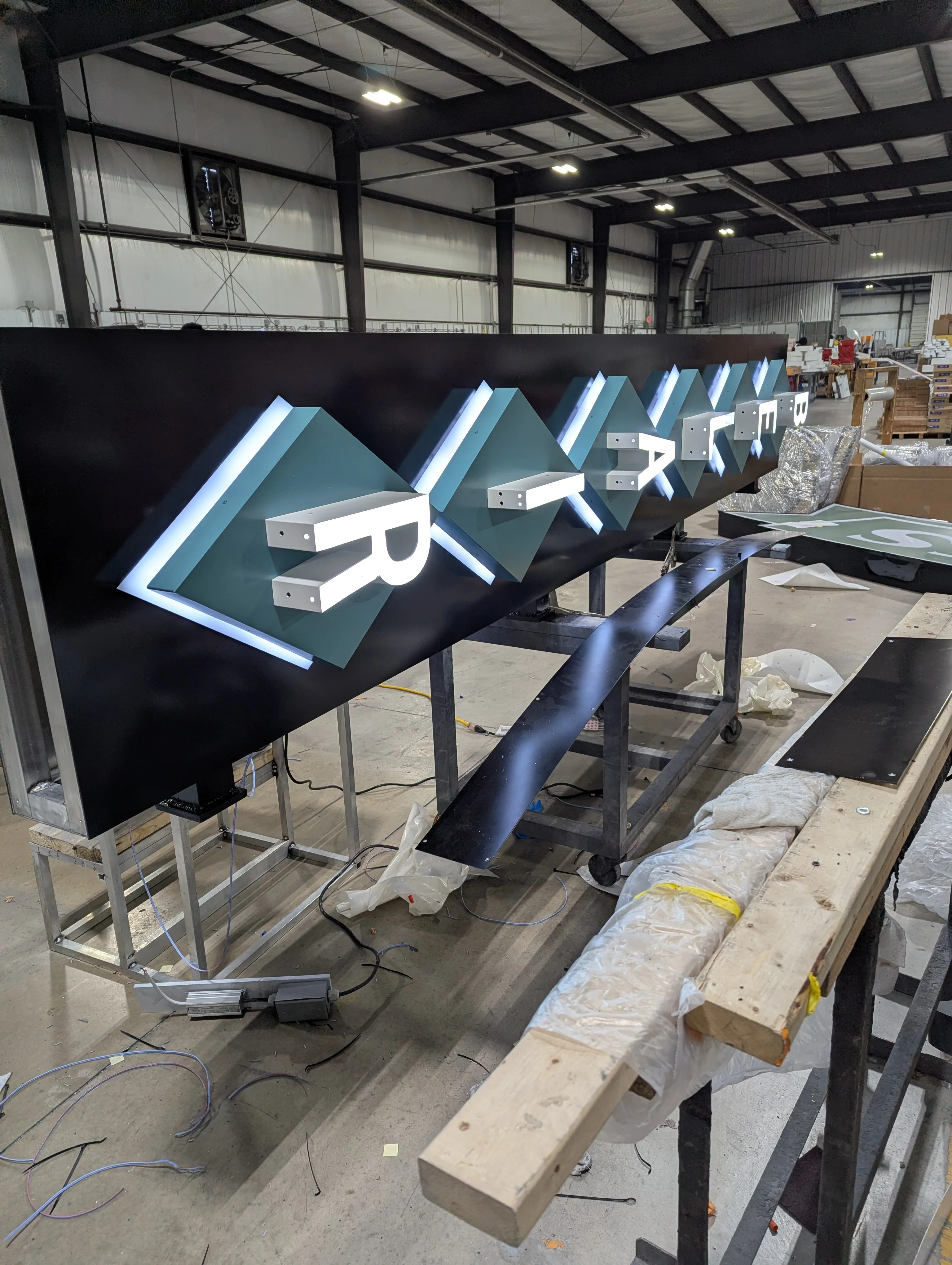 Actual illuminated Bel Air sign in the fabrication shop