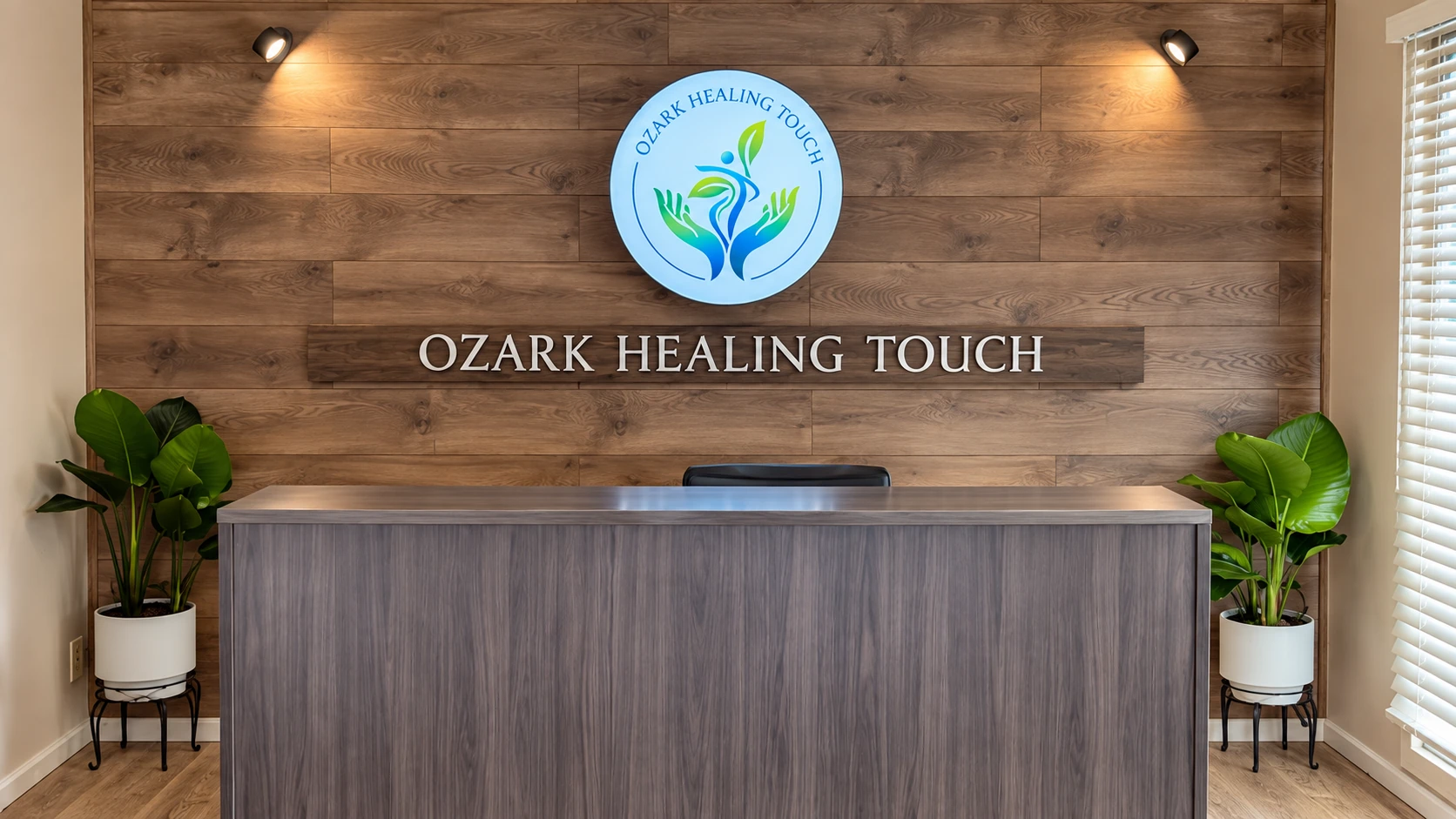 White flat-cut aluminum letters beside a separate illuminated round logo at Ozark Healing Touch